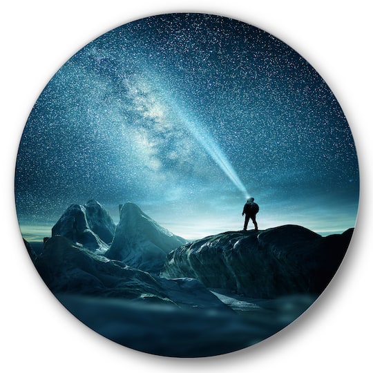 Designart - A Man Shining A Light Into The Night Sky